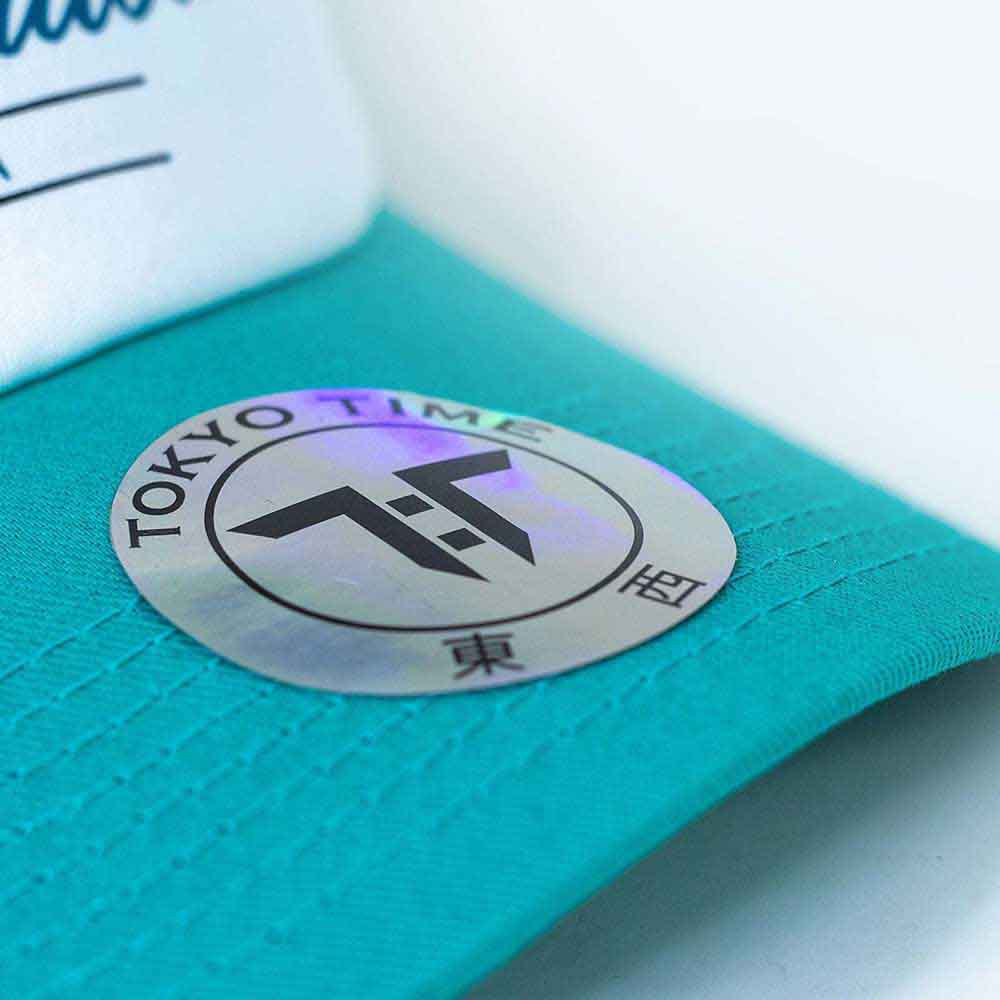 Tokyo Time Unisex Mesh Back Cap: NFLPA Tua Tagovalioa Emoji (White & Turquoise)